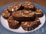 Рецепта Сладък салам с бисквити, орехи, кокосово масло, кокосово мляко и течен шоколад нутела (без яйца)